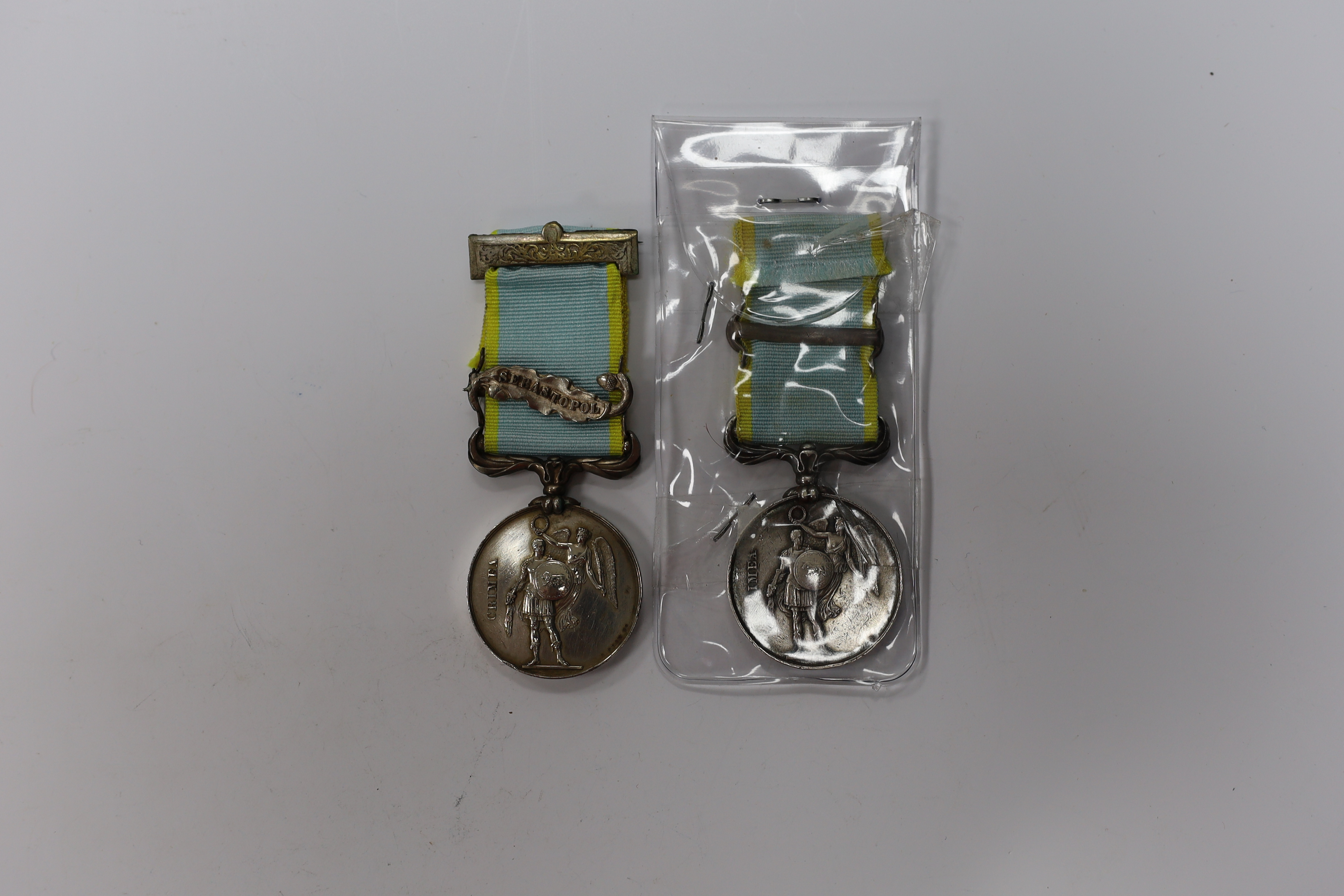 Two Crimea medals; one with Sebastopol clasp, the other Inkermann, both unnamed as issued